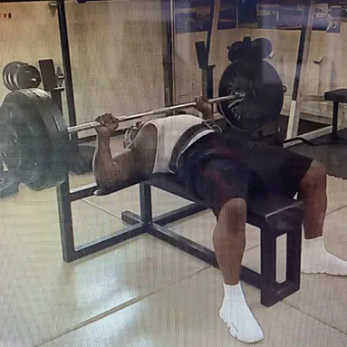 Man Bench Press Exercise in Gym