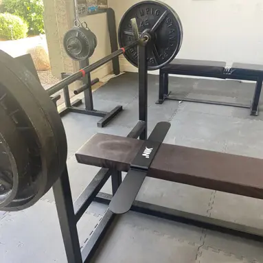 Weight Bench With Barbell in Gym